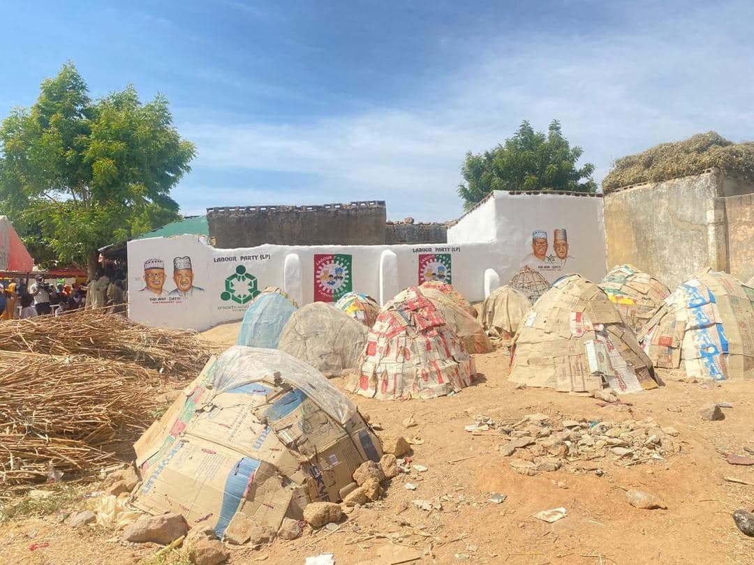 A community school rebuild in progress, with building materials on site.