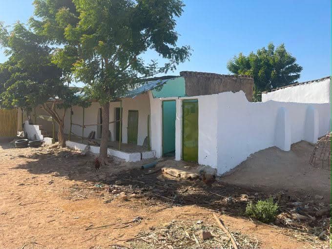 The rendered and whitewashed exterior of the completed compound.