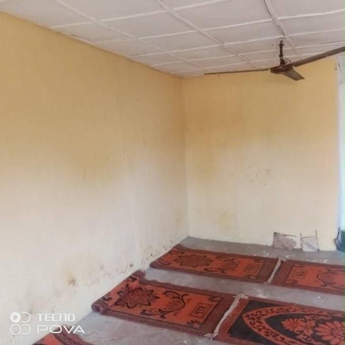 Prayer mats laid in the completed prayer space.